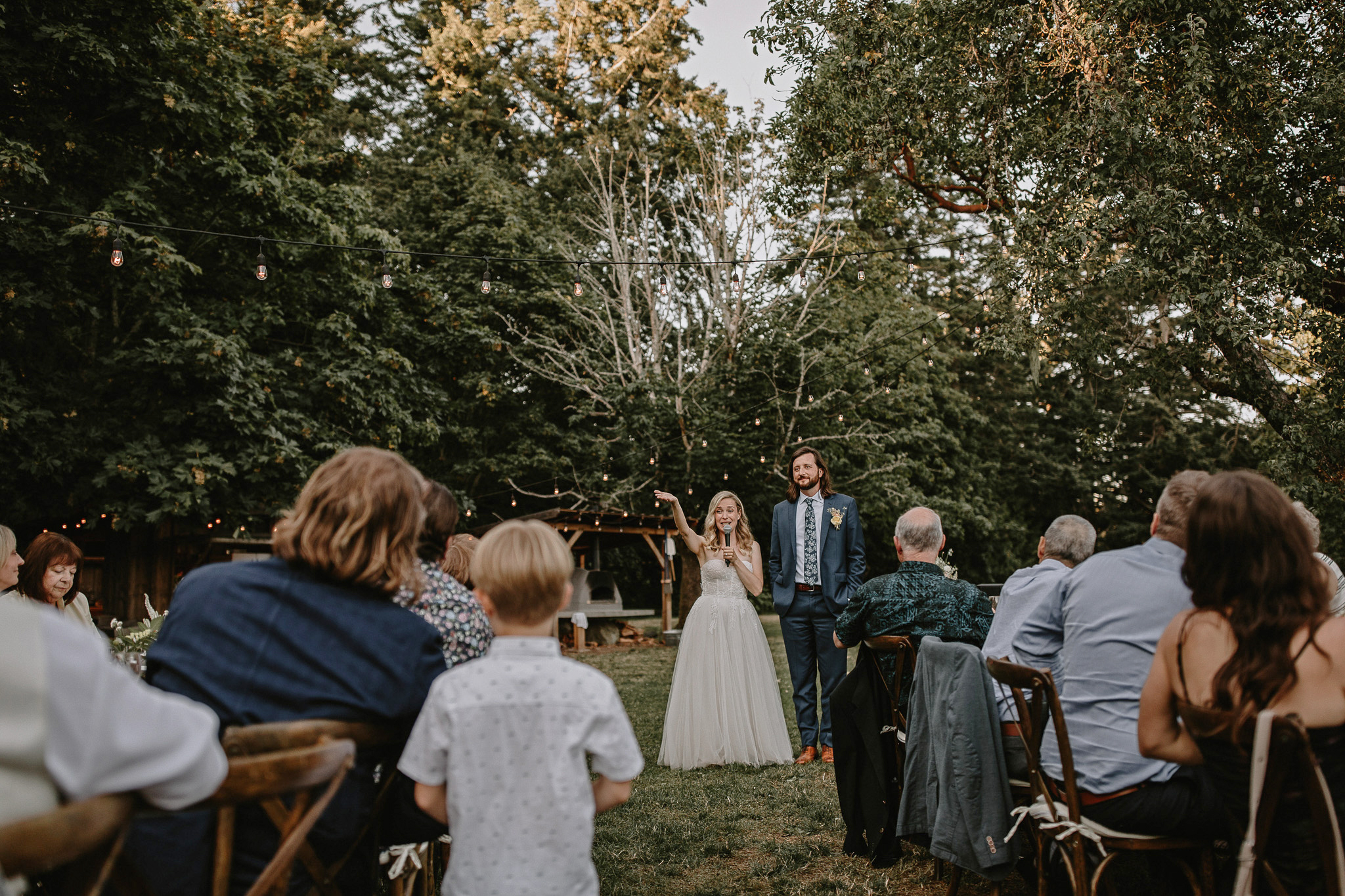 Couple giving their thank you toast at Bilston Creek Lavendar farm in victoria at an open air dinner party.