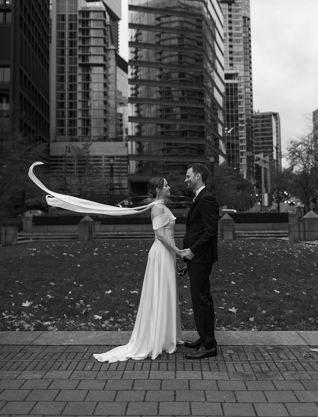 Bride and groom editorial wind swept candid portrait